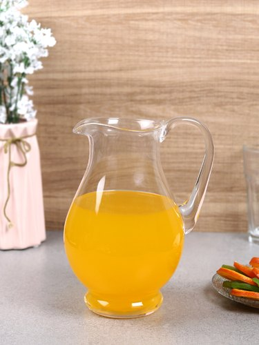 Traditional glass jug for serving liquids