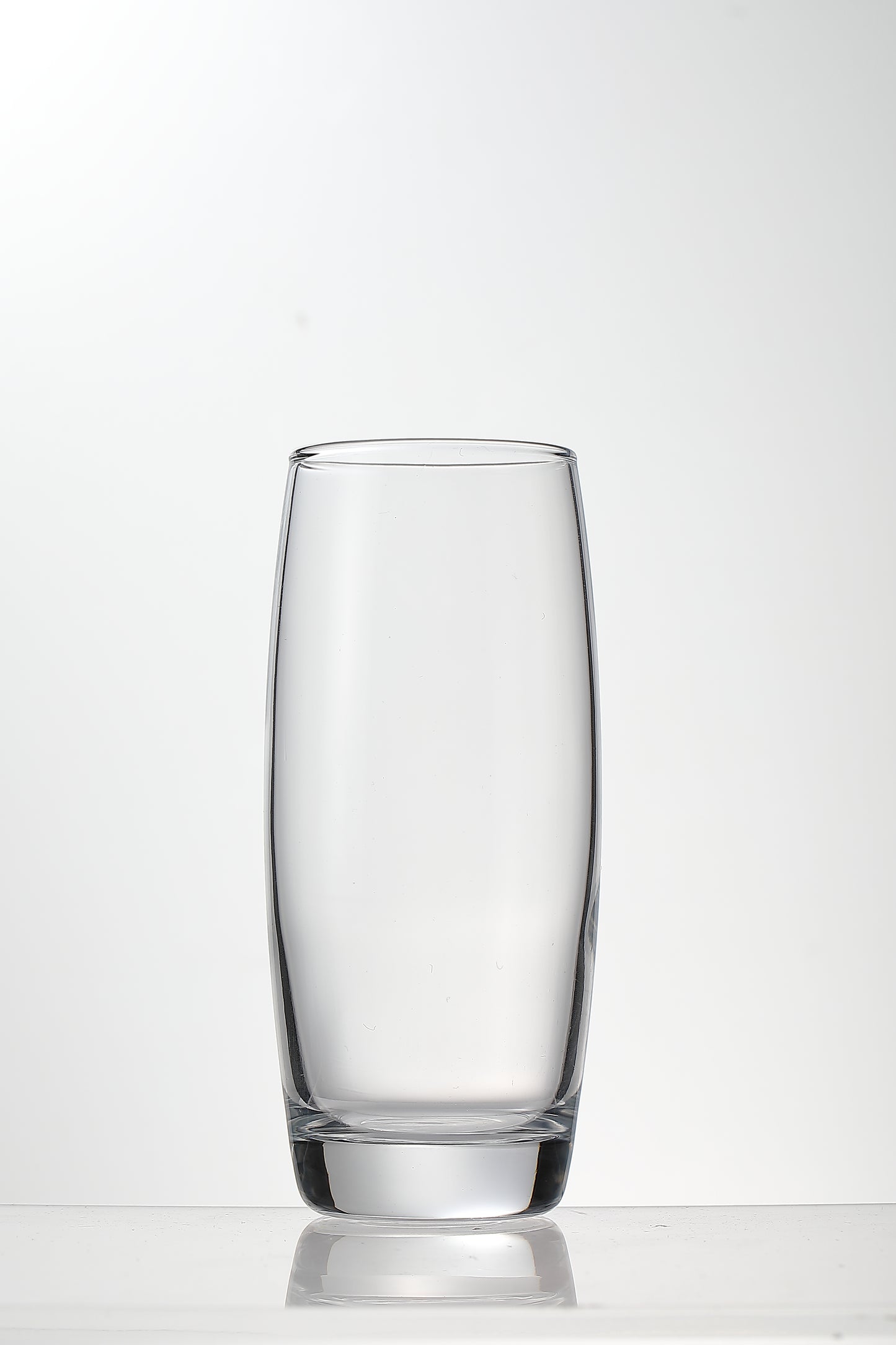 Empty Refresh Highball Glass on a modern dining table.