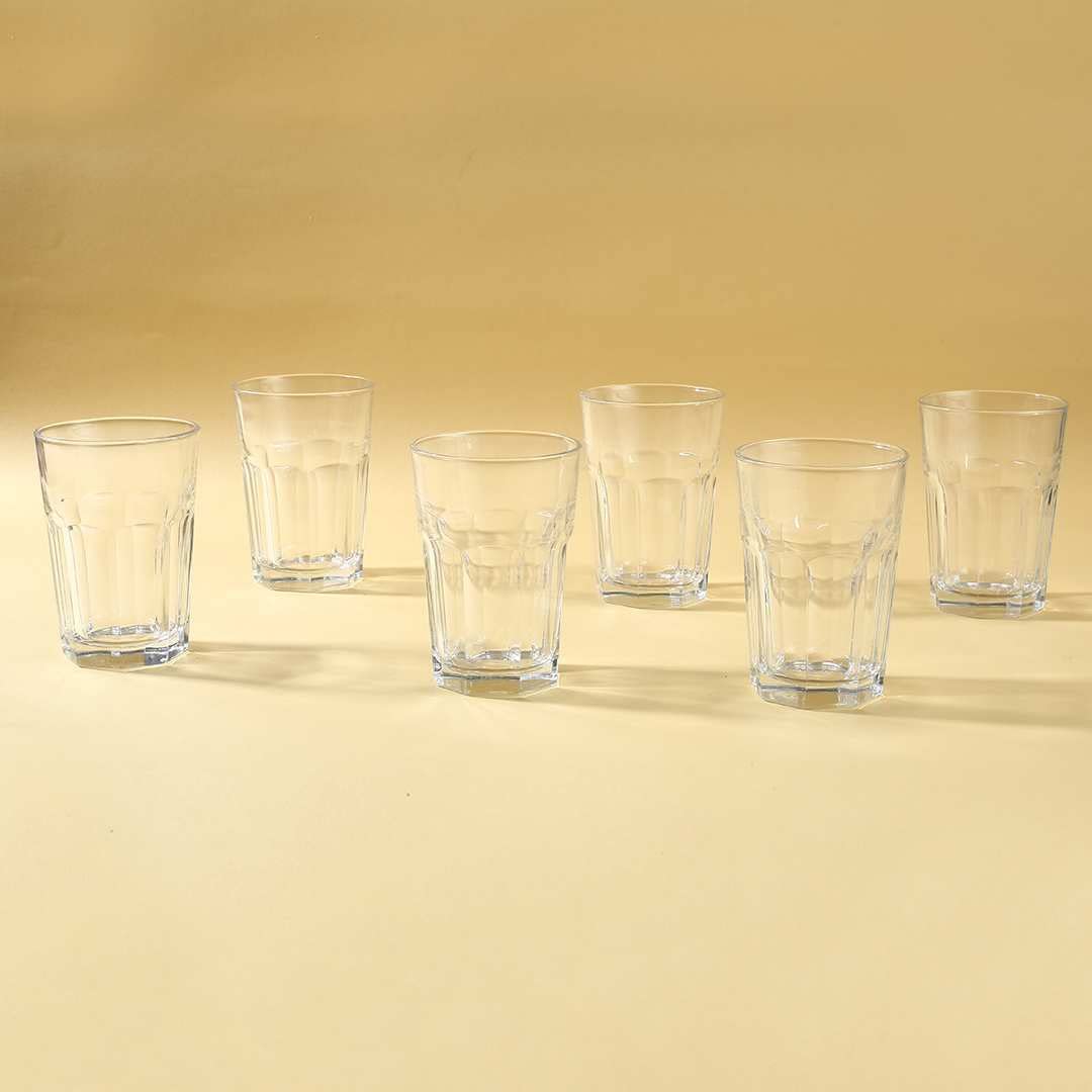 Set of highball glasses arranged neatly on a table