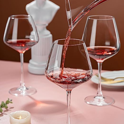 Elegant crystal red wine glasses with a long stem.