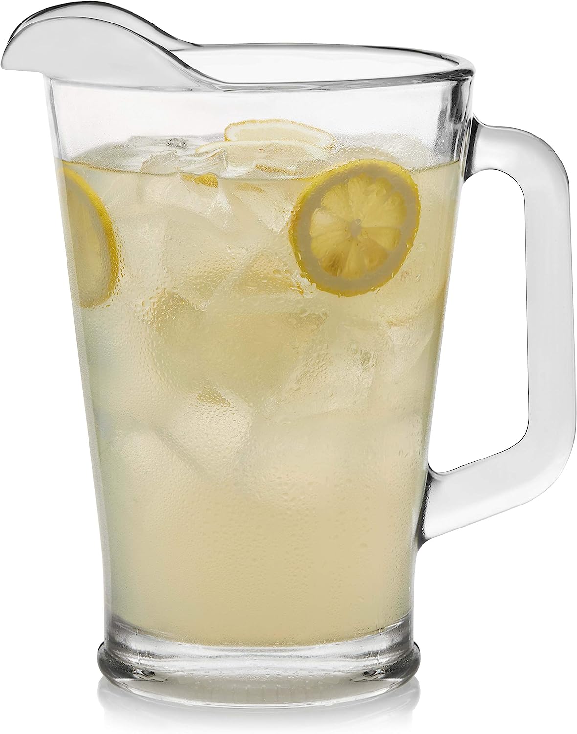 Glass pitcher jug with ice-cold water and lemon slices.