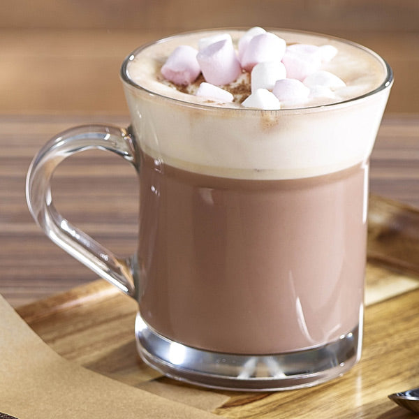 Miami Glass Mug filled with steaming coffee with marshmallows on a breakfast table.
