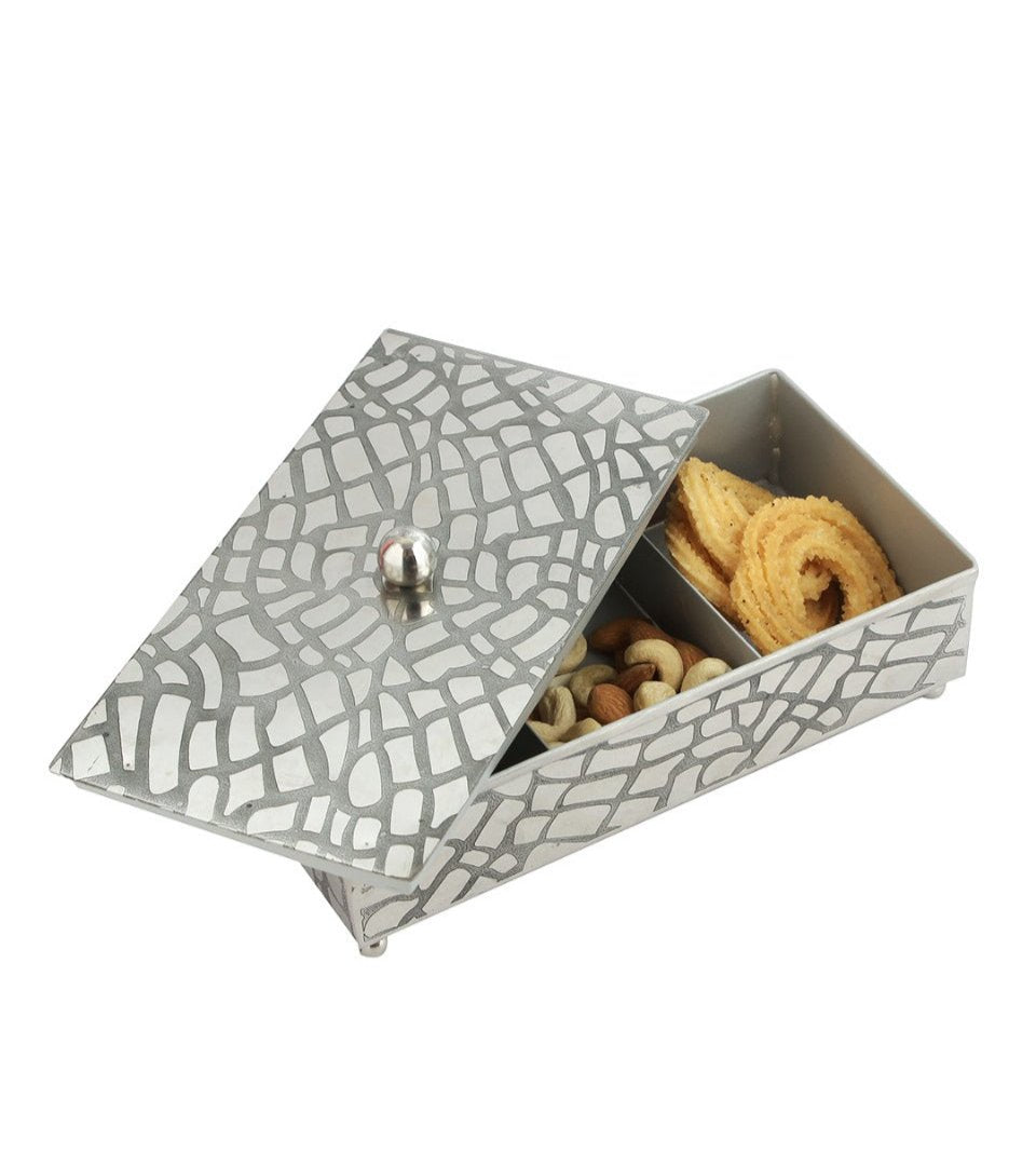 Close-up of the grid design on the stainless steel nut bowl.