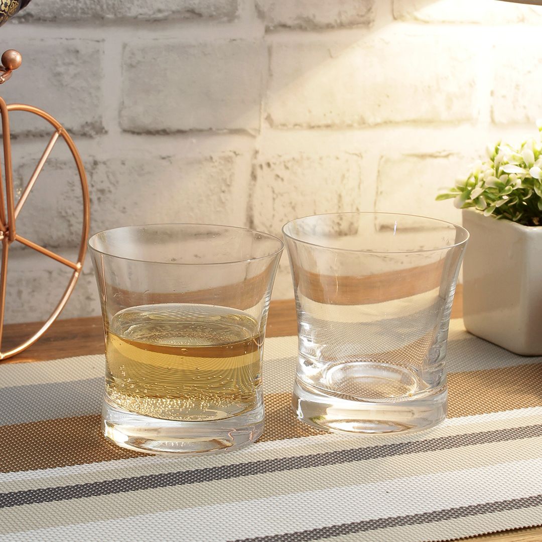 Modern whiskey glass with ergonomic shape and balanced weight
