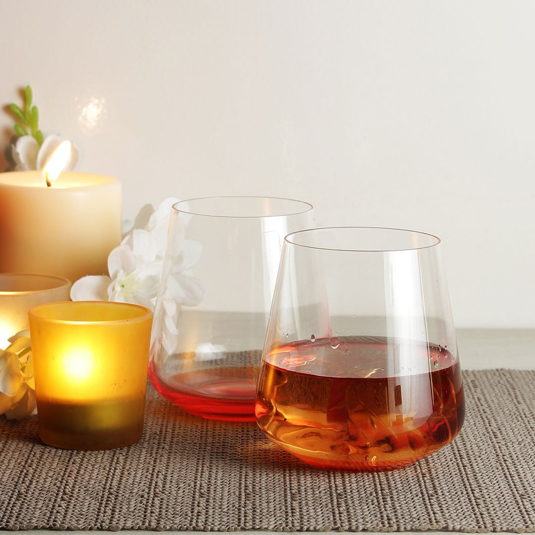 Close-up of Siesta Whiskey Glass showcasing its vibrant orange base