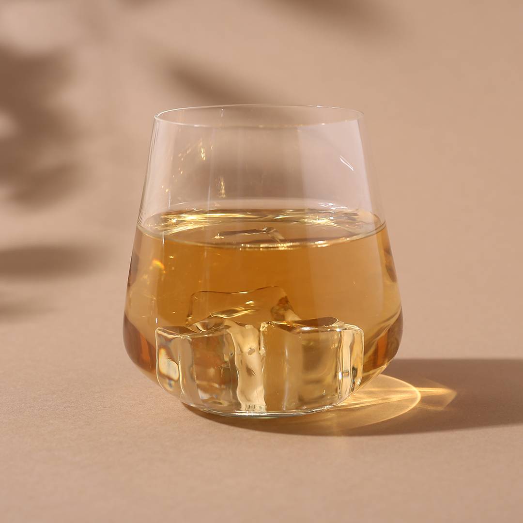 Sandra Whiskey Glass shining under soft lighting.