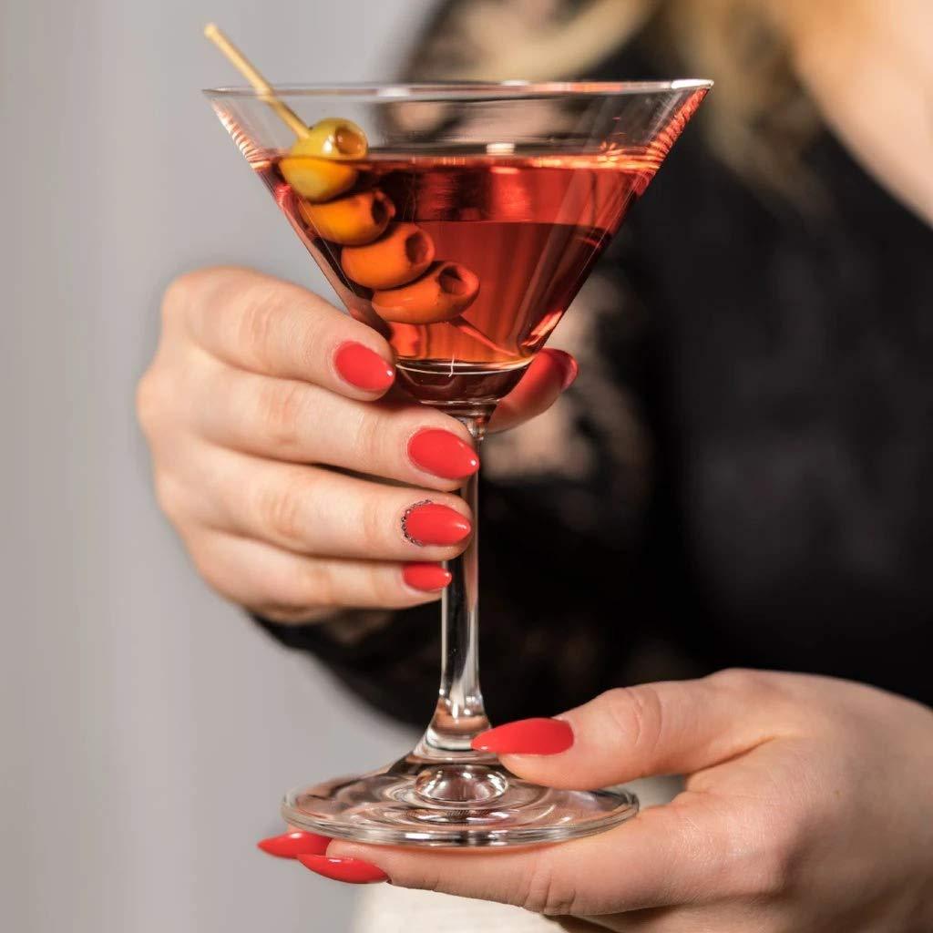 Hand holding Lara Martini Glass filled with cocktail