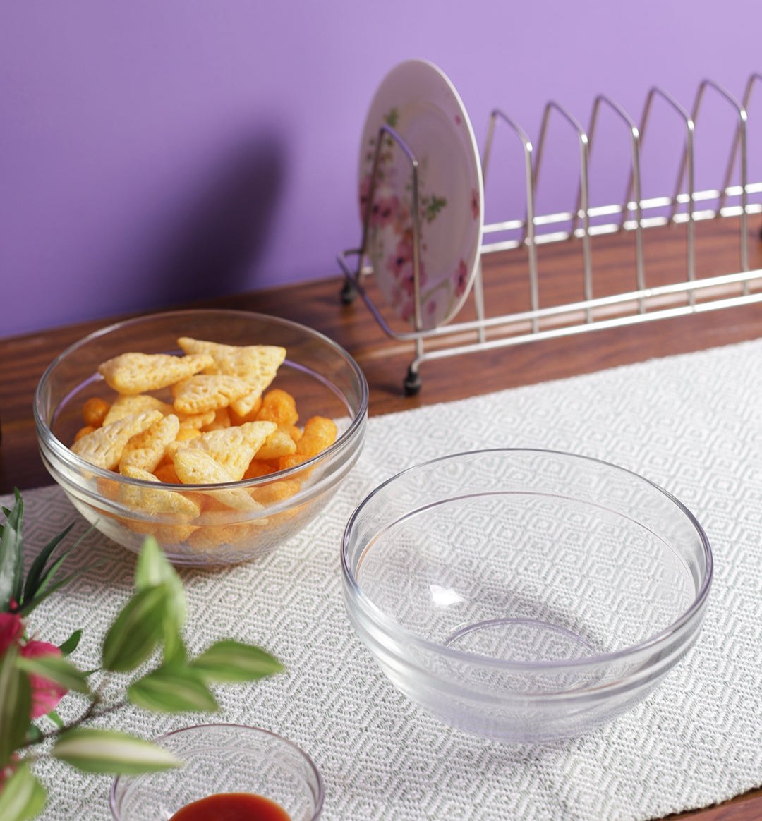 Set of three stackable glass bowls with ingredients ready for mixing.