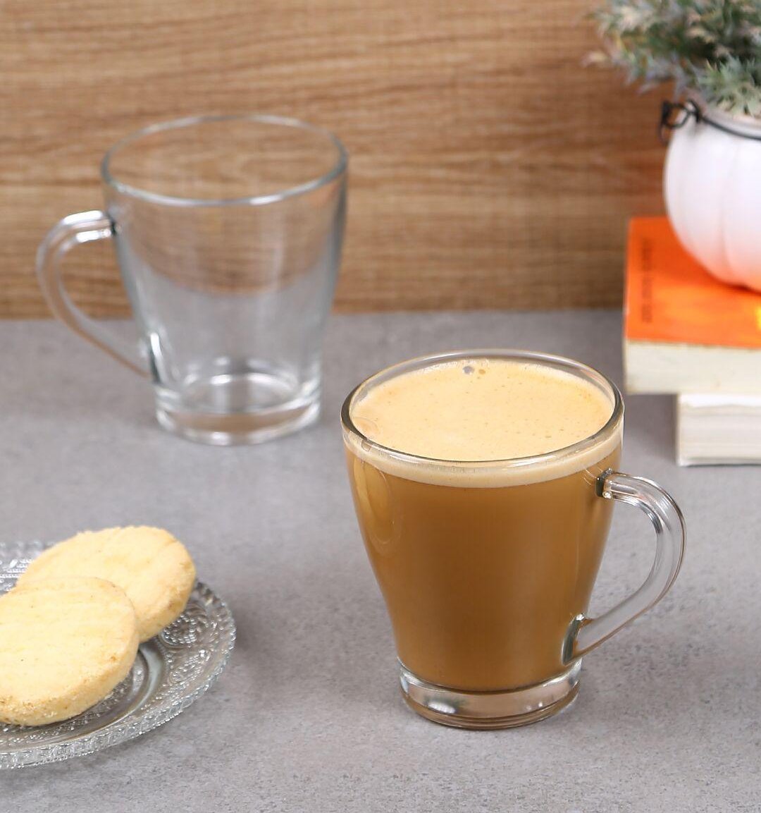 Close-up of steaming coffee in a clear Glass Mug.