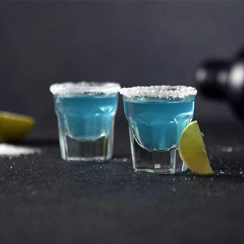 Pair of Marocco Shot Glasses filled with tequila