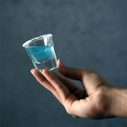 Hands holding Marocco Shot Glasses with colorful drinks