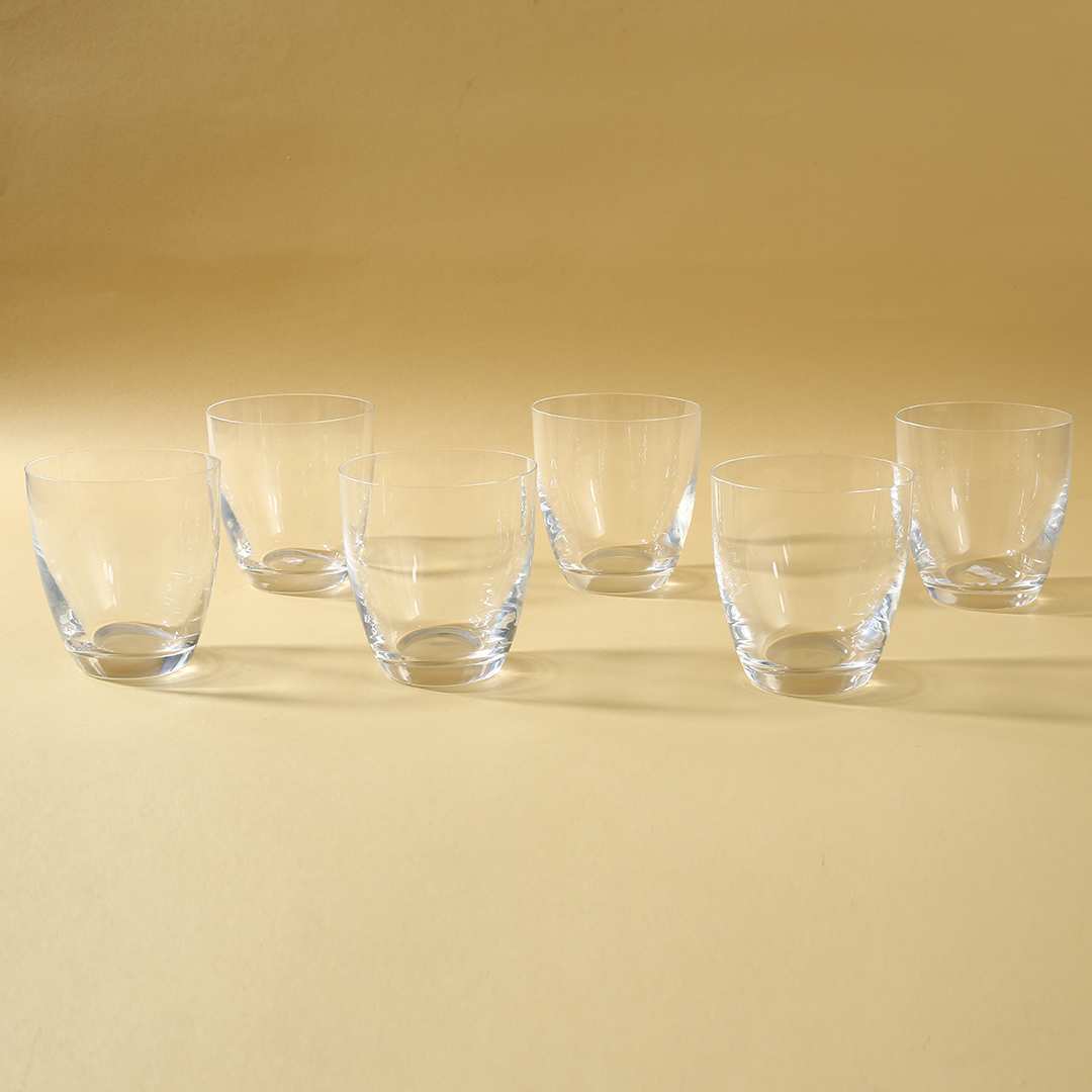 Elegant whiskey tumblers reflecting light with intricate design