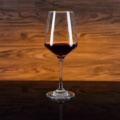 Premium crystal wine glass filled with red wine.