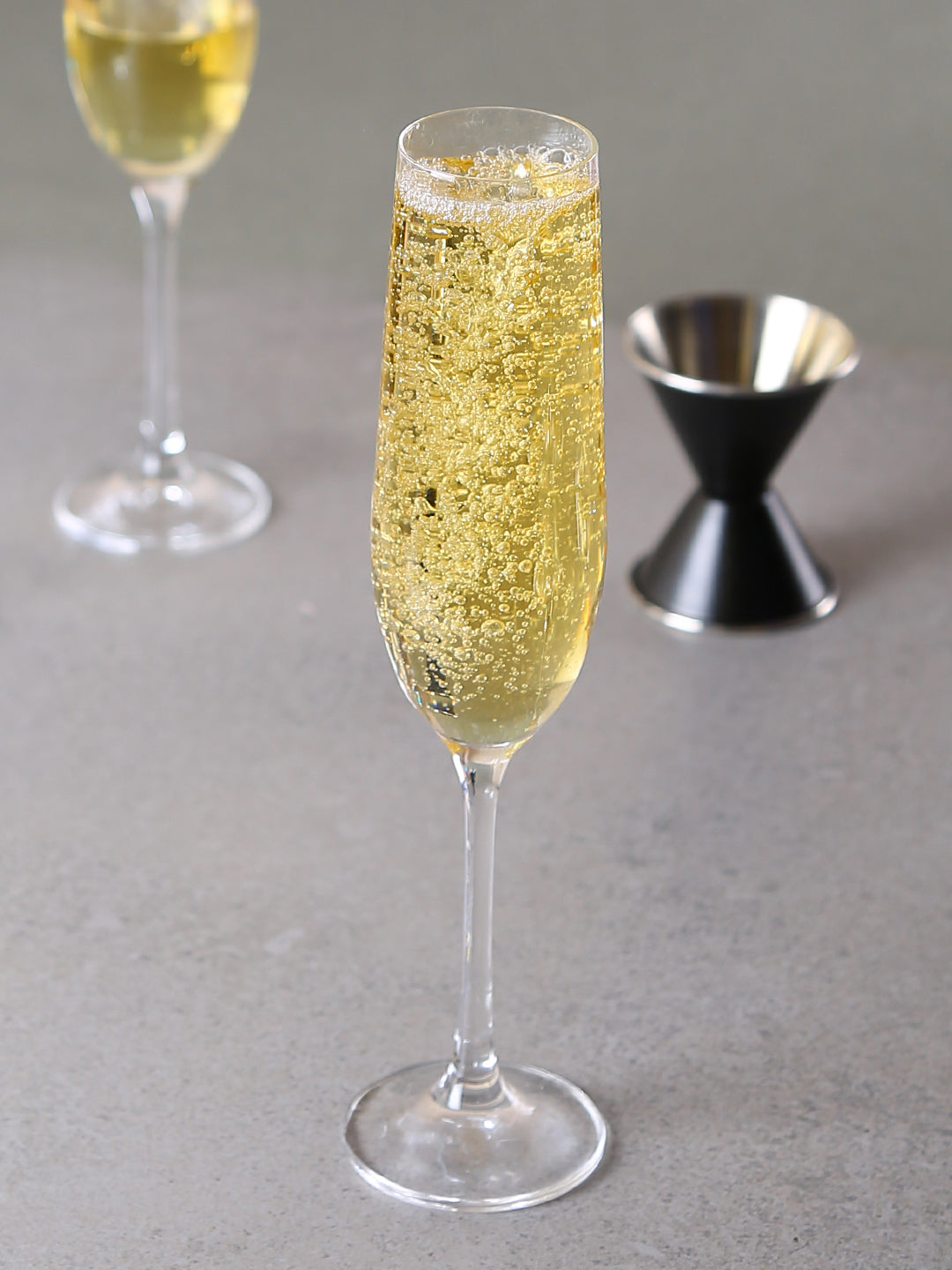 Elegant champagne flute with elongated bowl for preserving effervescence