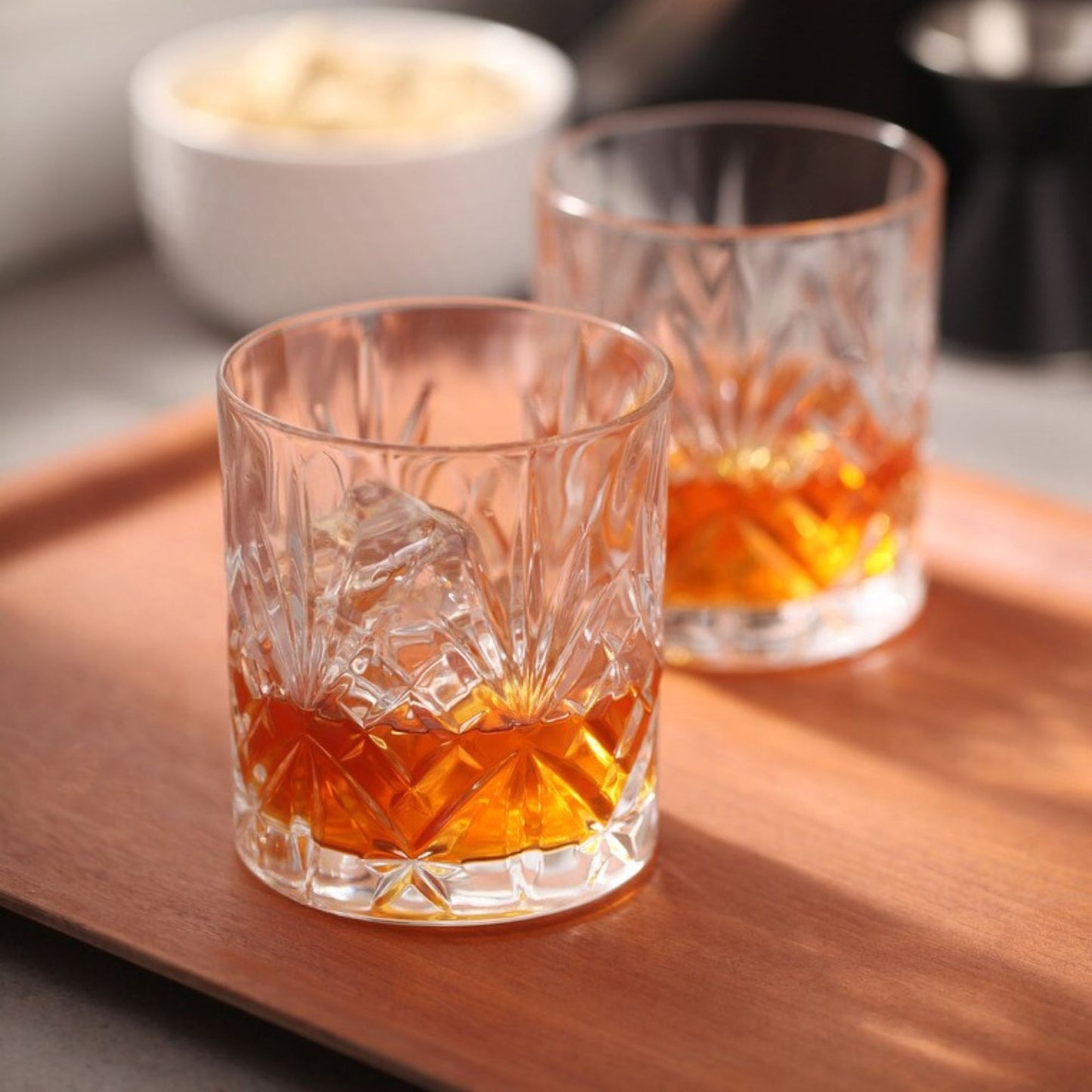 Whiskey Glass filled with amber whiskey.