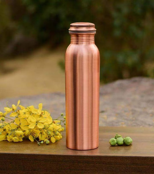 Pure copper water bottle with 1000ml capacity, shiny finish.