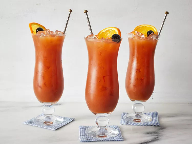 Crystal Clear Hurricane Glass filled with a tropical cocktail.