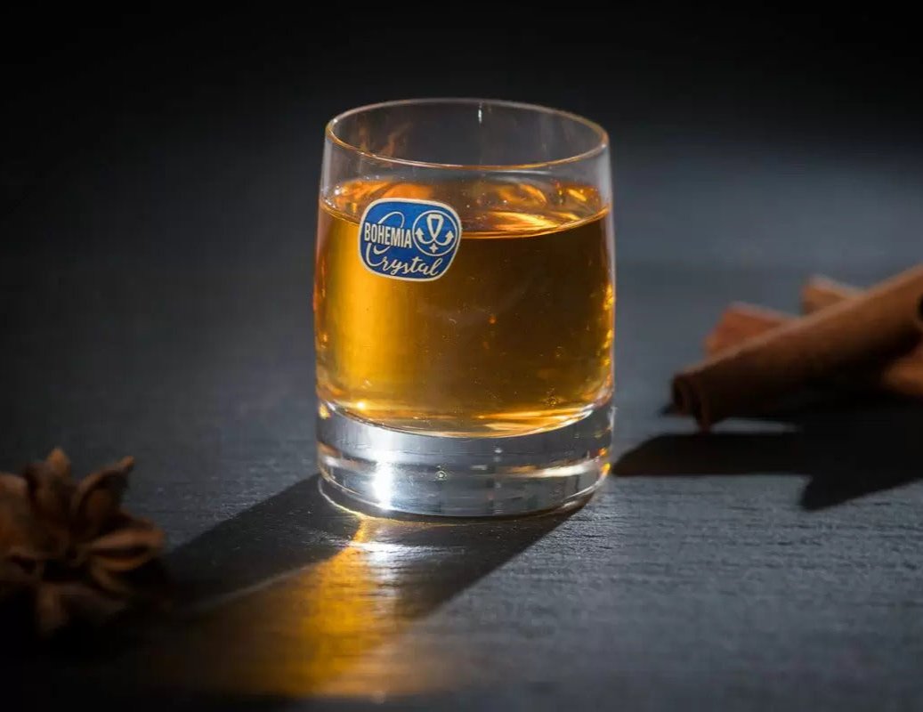 Clear Shot Glass on a wooden table setting