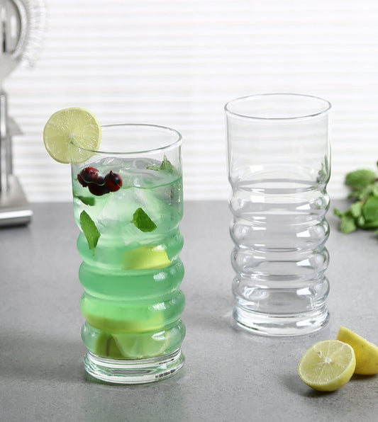 Twist tall glass filled with a colorful cocktail, showcasing the twist design.
